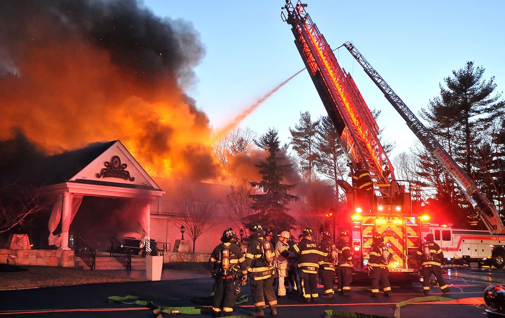 Firefighters respond to a multiple alarm fire at the popular Lakeview Pavilion in Foxboro, Mass. A wedding was taking place at the time of the fire.