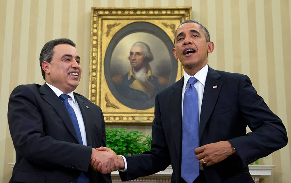 President Barack Obama and Tunisian Prime Minister Mehdi Jomaa shakes hands after speaking to the media, in the Oval Office of the White House in Washington.