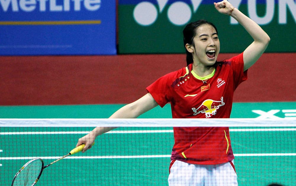 China’s Wang Shixian celebrates her victory against Wang Yihan of China during the women’s semifinal match at the Yonex Sunrise India Open 2014 badminton tournament in New Delhi.