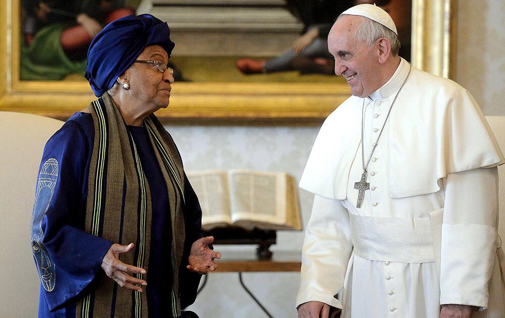 Pope Francis, right, meets Liberia`s President Ellen Johnson Sirleaf during an audience at the Vatican.