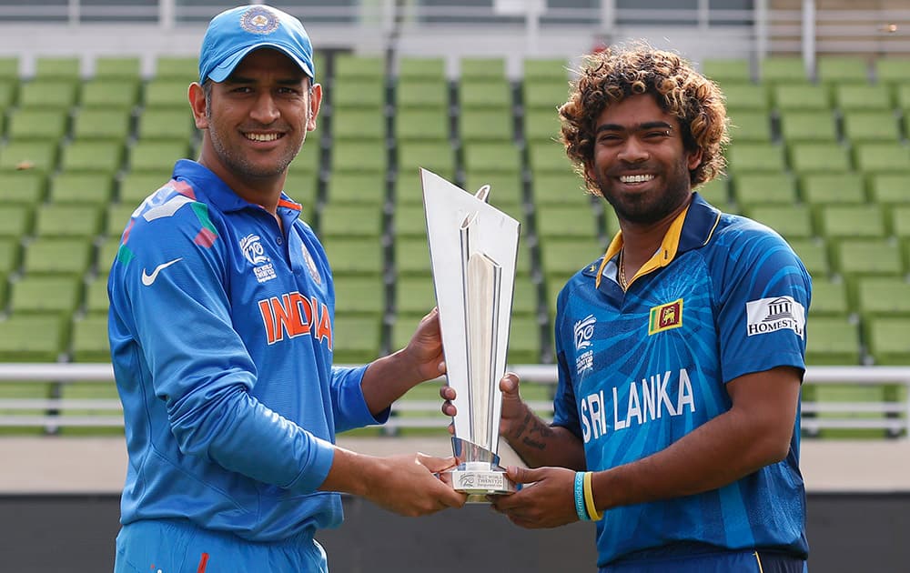 Mahendra Singh Dhoni, left, and Sri Lanka`s captain Lasith Malinga pose with the winners trophy ahead of the ICC Twenty20 Cricket World Cup final match in Dhaka, Bangladesh.