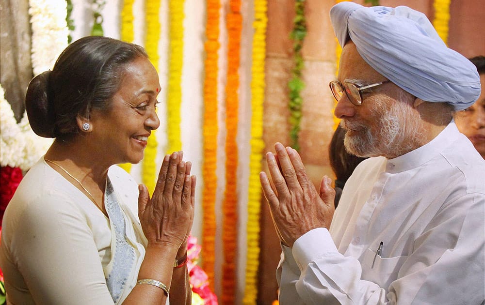 Prime Minister Manmohan Singh exchanges greetings with Lok Sabha Speakar Meira Kumar after paying tributes to Babu Jagjivan Ram on his birth anniversary in Parliament house in New Delhi.