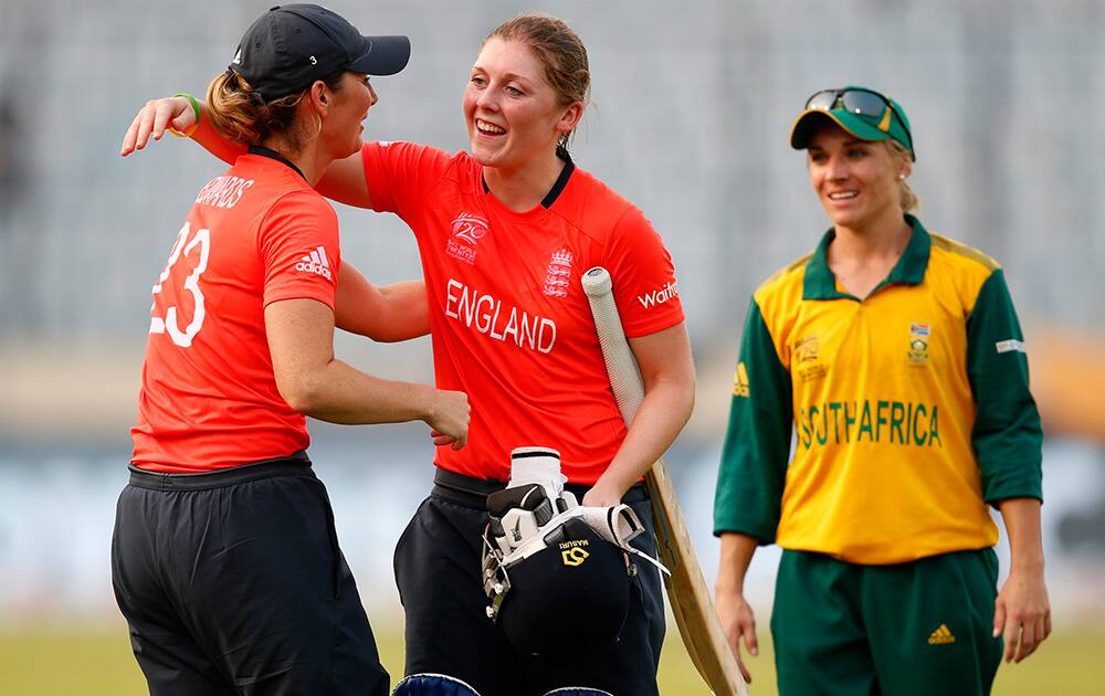 South Africa`s captain Mignon Du Preez watches England captain Charlotte Edwards greet teammate Heather Knight on their win in the ICC Women`s Twenty20 Cricket World Cup semi-final match in Dhaka, Bangladesh.