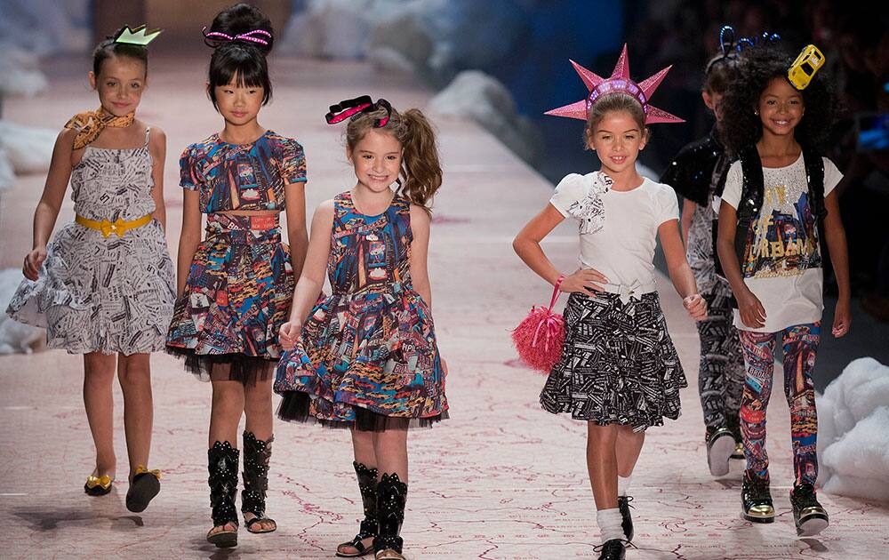 Children wear outfits from the children`s brand Lilica Ripilica during the Sao Paulo Fashion Week in Sao Paulo, Brazil.