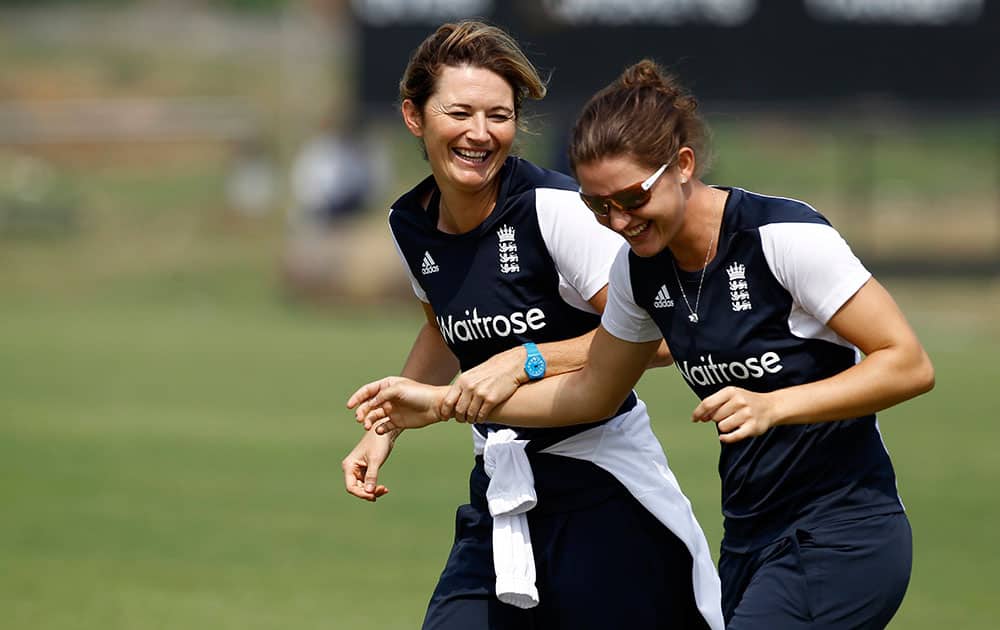 England’s women cricket captain Charlotte Edwards, left, and a teammate attend a training session ahead of their ICC Twenty20 Cricket World Cup semi-final match against South Africa in Savar, near Dhaka, Bangladesh.