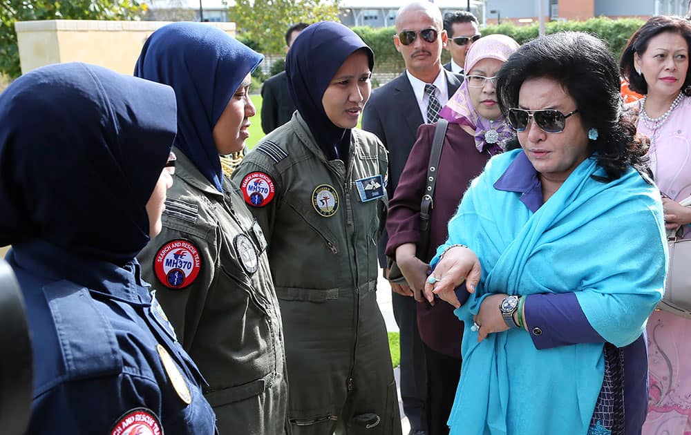 Rosmah Mansor, right, wife of Malaysian Prime Minister Najib Razak meets with aircrew crew members involved in the search for wreckage and debris of the missing Malaysia Airlines flight MH370 in Perth, Australia.