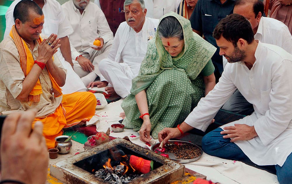 Congress President Sonia Gandhi and Vice President Rahul Gandhi offering puja before filling her nomination in Raebareli.