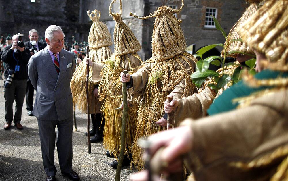 Britain`s Prince Charles meets Aughakillymaude Mummers in costume during a visit to Fermanagh County Museum, Enniskillien, Northern Ireland.