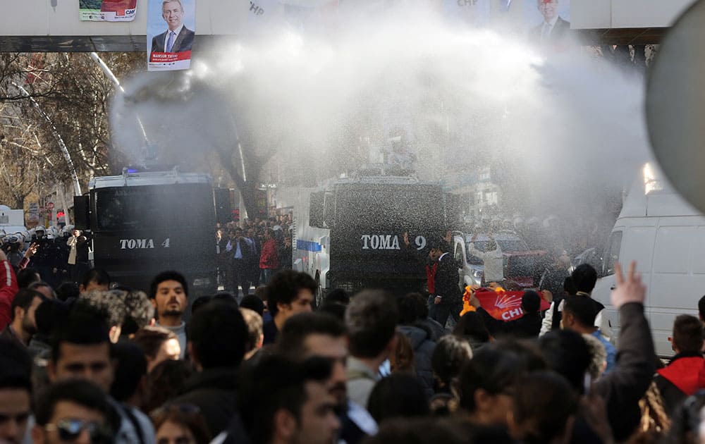 Police use water cannons to break up a protest by hundreds of people who had gathered outside Turkey`s Supreme Election Council building in support of the countryâ??s main opposition party which is challenging local elections results in the capital Ankara, Turkey.