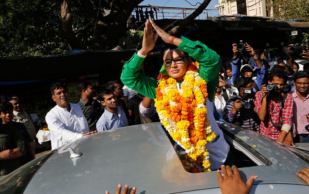 Bollywood actress Rakhi Sawant greets people after filing her nomination as a candidate for the upcoming general elections in Mumbai.