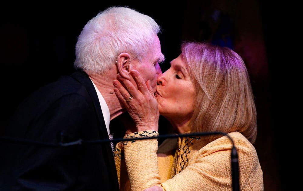Former New Jersey Gov. Brendan Byrne, left, gets a kiss from his wife, Ruth Byrne, during a celebrity comedy roast in honor of his 90th birthday in Newark, N.J.