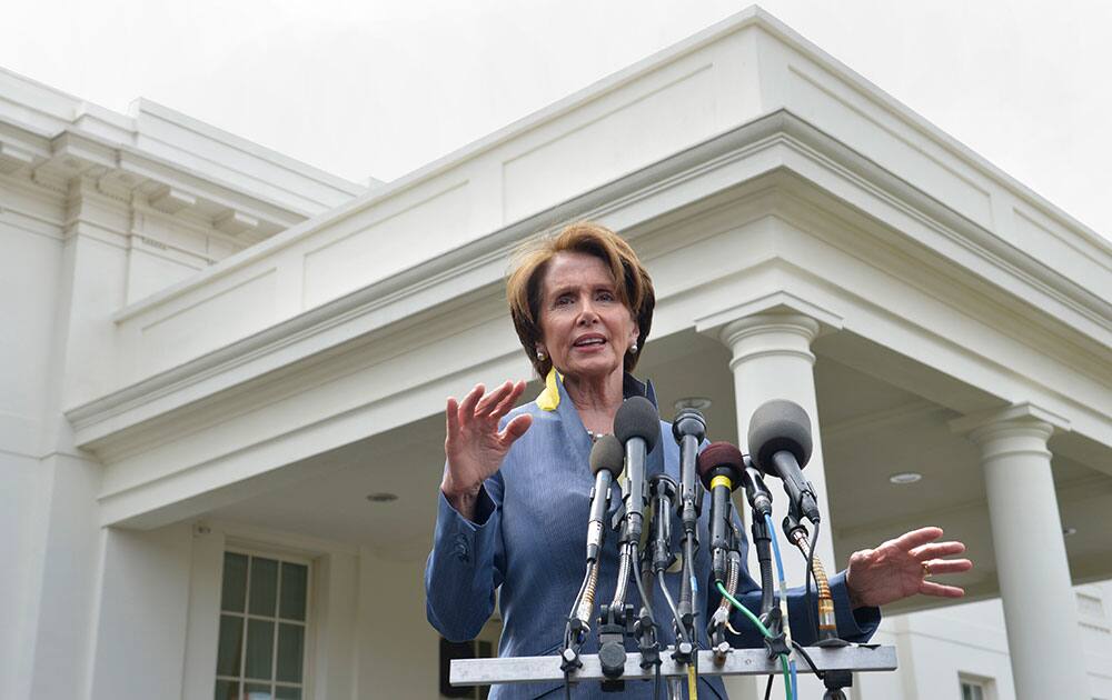 House Minority Leader Nancy Pelosi of Calif. speaks to reporters outside the West Wing of the White House in Washington, following her lunch with President Barack Obama. Pelosi was asked several questions about the Affordable Care Act.