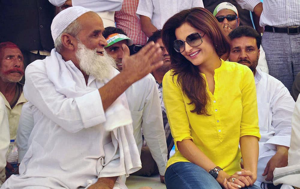 Bollywood actress Monika Bedi campaigning for Congress candidate Acharaya Pramod Krishnam during an election campaign in Sambhal.