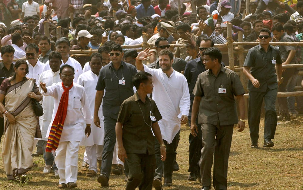 Rahul Gandhi waves to the crowd as he leaves after addressing an election campaign rally at Semiliguda in Koraput district, Orissa.