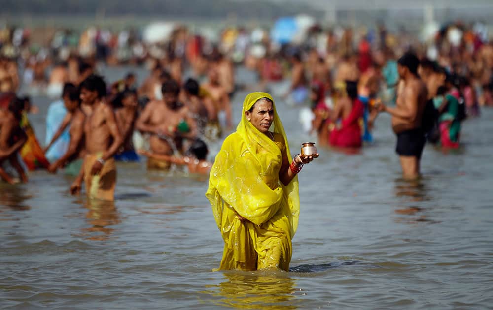 A Hindu devotee returns after performing morning rituals on the banks of the Ganges River on the first day of the nine-day Hindu festival of Navratri, in Allahabad.