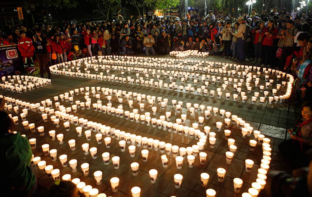 Candles placed by participants to create the number 60, representing the minutes in an hour, marking Earth Hour in La Paz, Bolivia.