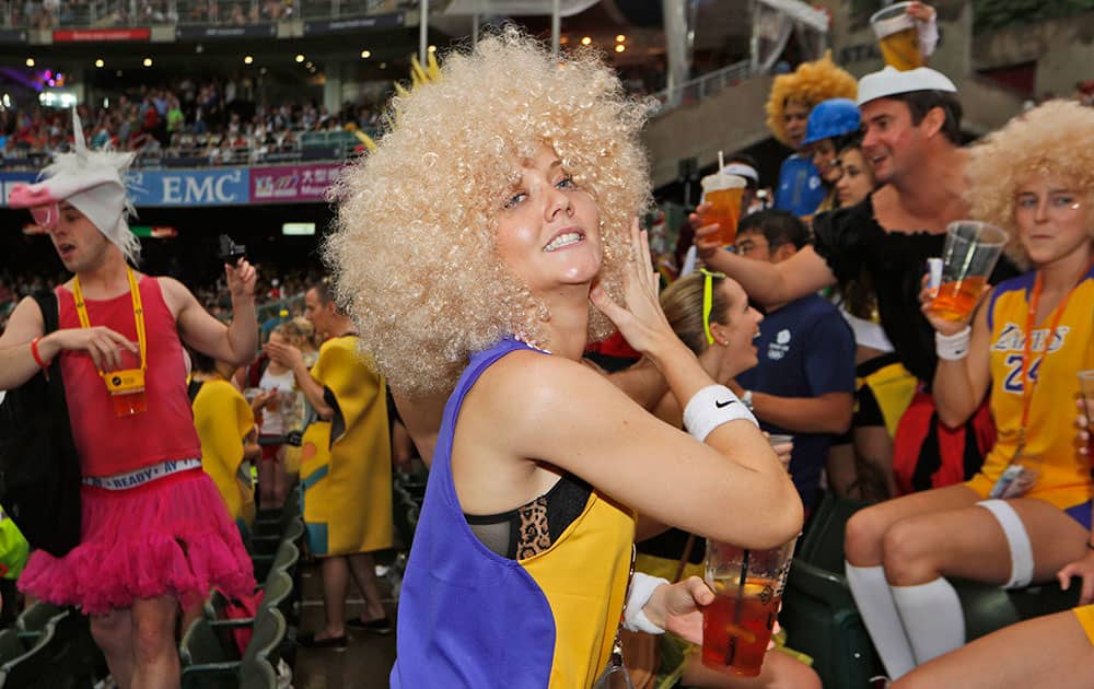 A rugby fan dances during the second day match of the Hong Kong Sevens rugby tournament in Hong Kong.