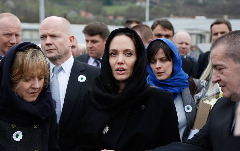 UNHCR goodwill ambassador Angelina Jolie accompanied by British Foreign Secretary William Hague pay their respects to victims at memorial center of Potocari near eastern Bosnian town of Srebrenica, 180 kms northeast of Sarajevo.
