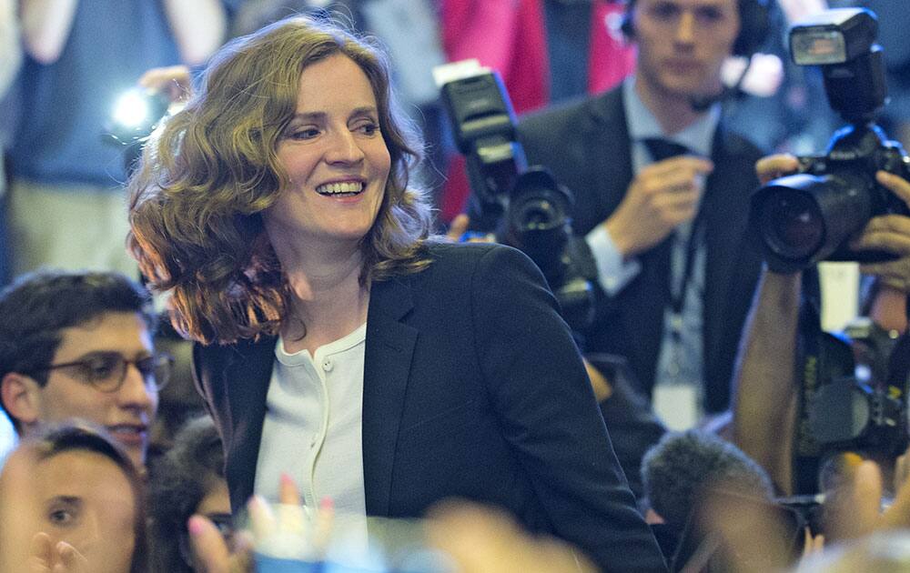 Nathalie Kosciusko-Morizet, the conservative UMP political party candidate for the upcoming election for the mayor of Paris, is carried by his supporters during a campaign meeting in Paris.