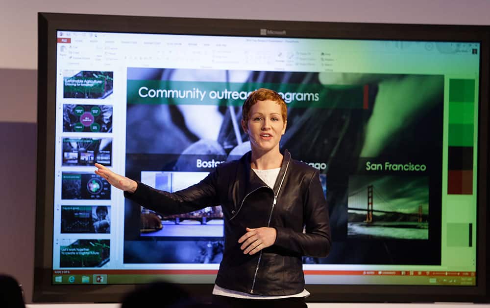 Microsoft General Manager Julia White gestures while talking about the Office 365 app during a press briefing, in San Francisco.