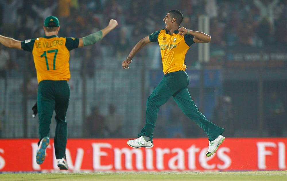 South African cricketer Beuran Hendricks jumps in the air, celebrating the dismissal of Netherlands` Timm van der Gugten during their ICC Twenty20 Cricket World Cup match in Chittagong, Bangladesh.