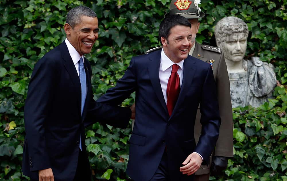 Italian Premier Matteo Renzi and President Barack Obama smile as they arrive at Rome`s Villa Madama for a bilateral meeting.
