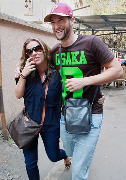 South African cricketer Wayne Parnell along with an unidentified woman arrives at the Sessions Court in Mumbai on Thursday in connection with a drug related case.