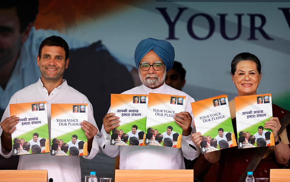Congress party Vice President Rahul Gandhi, Indian Prime Minister Manmohan Singh, and Congress party President Sonia Gandhi release party manifesto ahead of the general elections, in New Delhi.