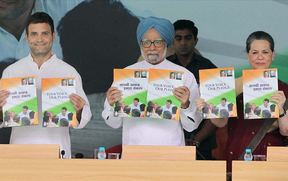 Prime Minister Manmohan Singh, Congress President Sonia Gandhi and party Vice President Rahul Gandhi releasing the partys election manifesto titled Your Voice Our Pledge at AICC Headquarters in New Delhi.