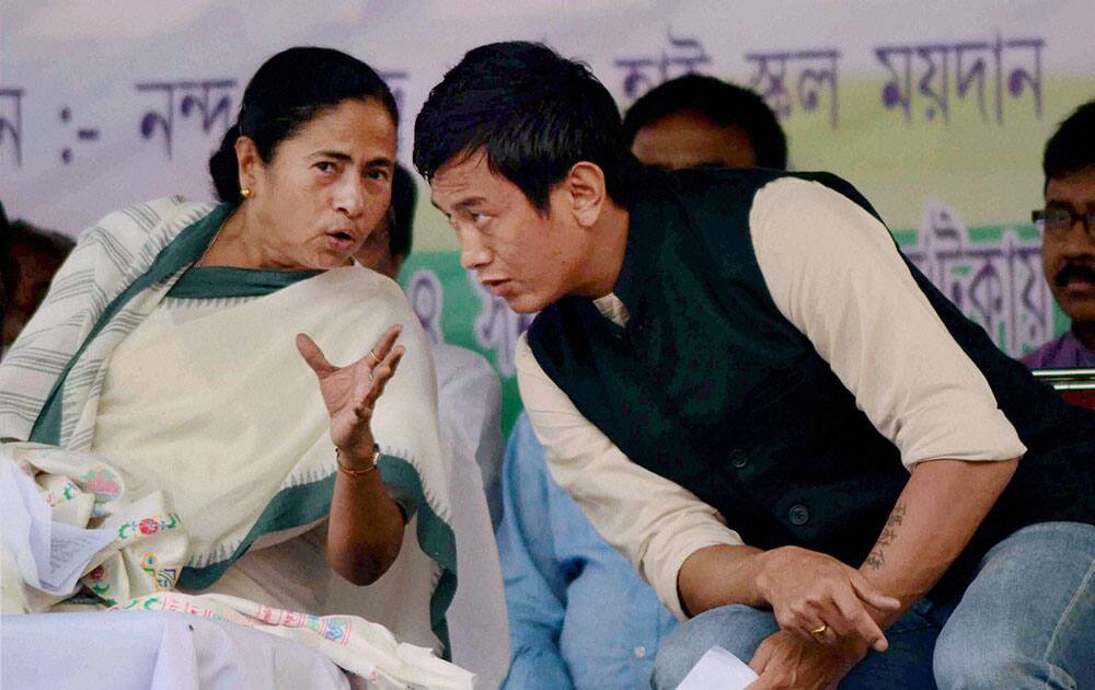 West Bengal Chief Minister and TMC chief Mamata Banerjee with party candidate Baichung Bhutia during an election campaign rally at Naxalbari near Siliguri.