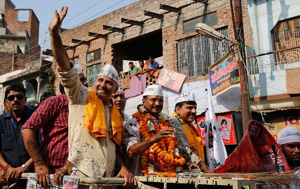 Ink is seen splattered on the clothes of Aam Aadmi Party (AAP), or the common man party, chief Arvind Kejriwal, center, and supporters during an election campaign in Varanasi.