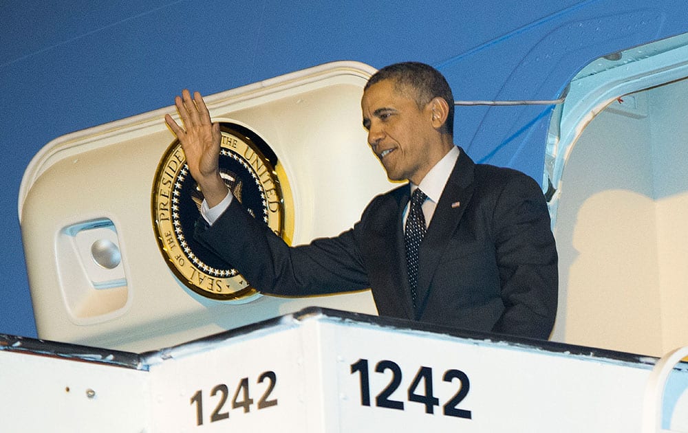 US President Barack Obama waves upon his arrival on Air Force One at Brussels International Airport.