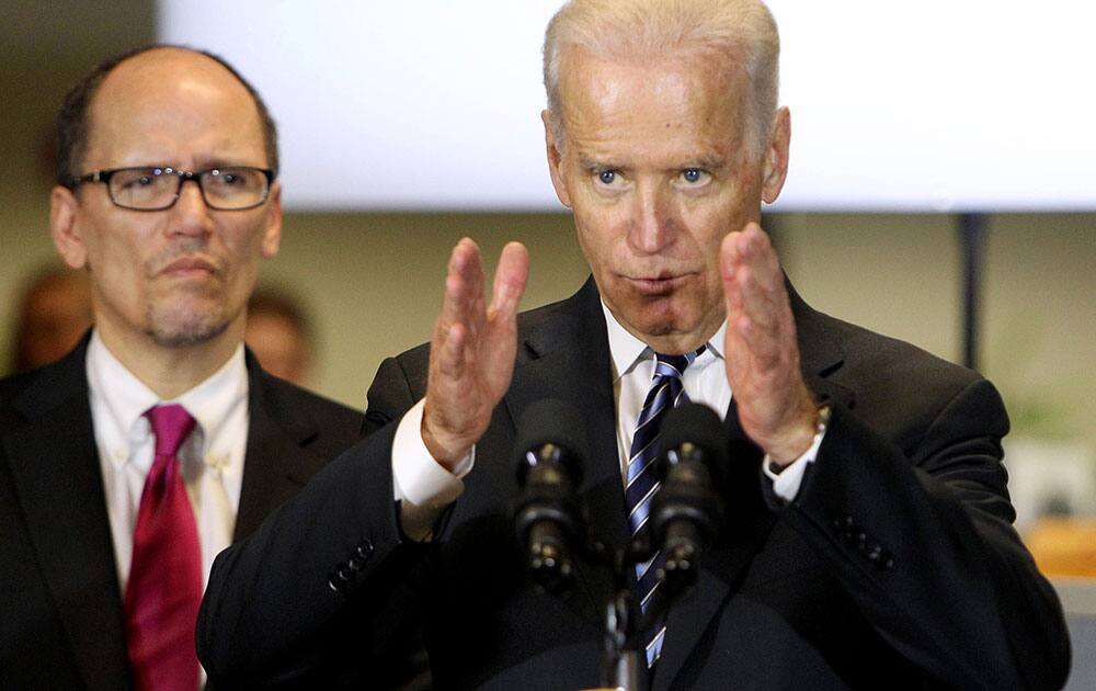 Vice President Joe Biden, accompanied by Labor Secretary Thomas Perez speaks at the New Hampshire Works center, in Nashua, N.H.