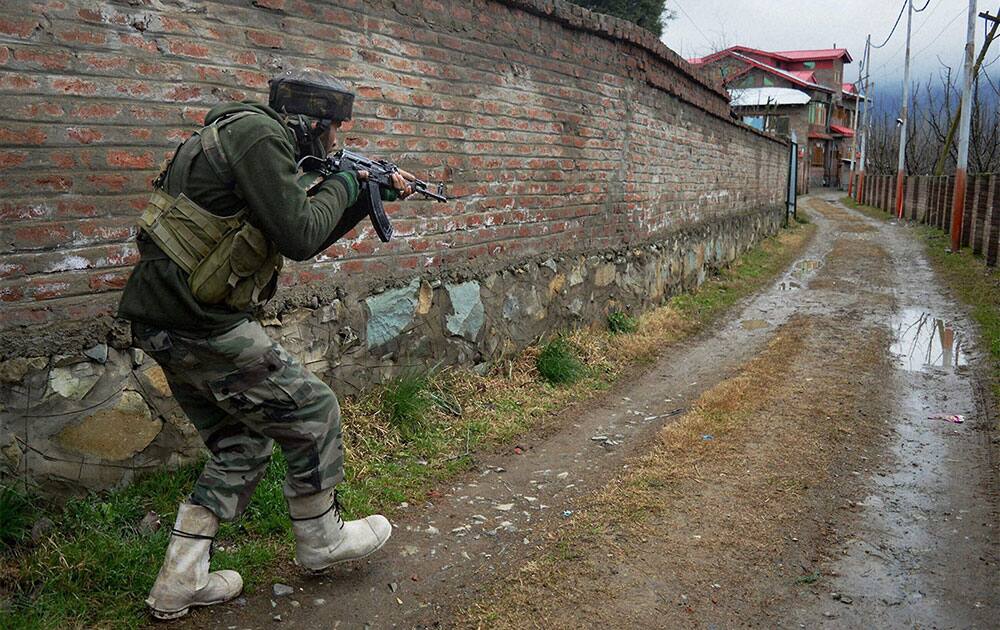 An army soldier during a search operation in the Tral area of Pulwama district on Tuesday a day after militants opened fire on a narmy patrolling party.