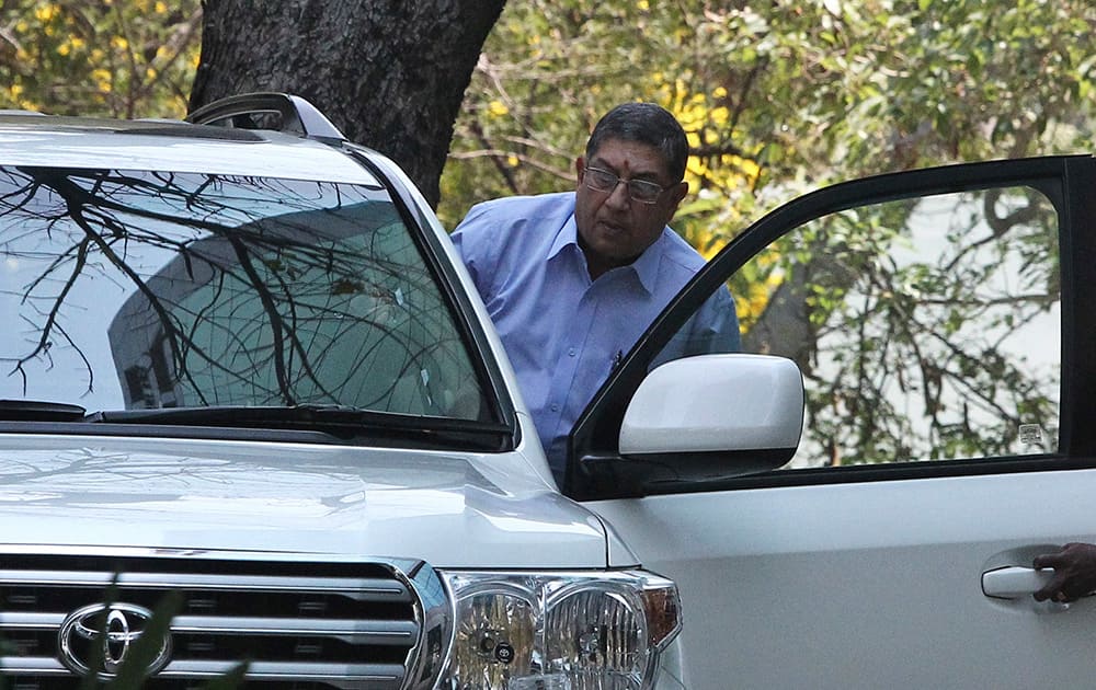 Indian cricket board chief Narayanaswami Srinivasan gets into his car at the premises of the corporate office of India Cements, a company headed by him in Chennai. The Supreme Court of India has told Srinivasan to step down from his post or be forced to leave to ensure a fair investigation into charges of match-fixing in the Indian Premier League.