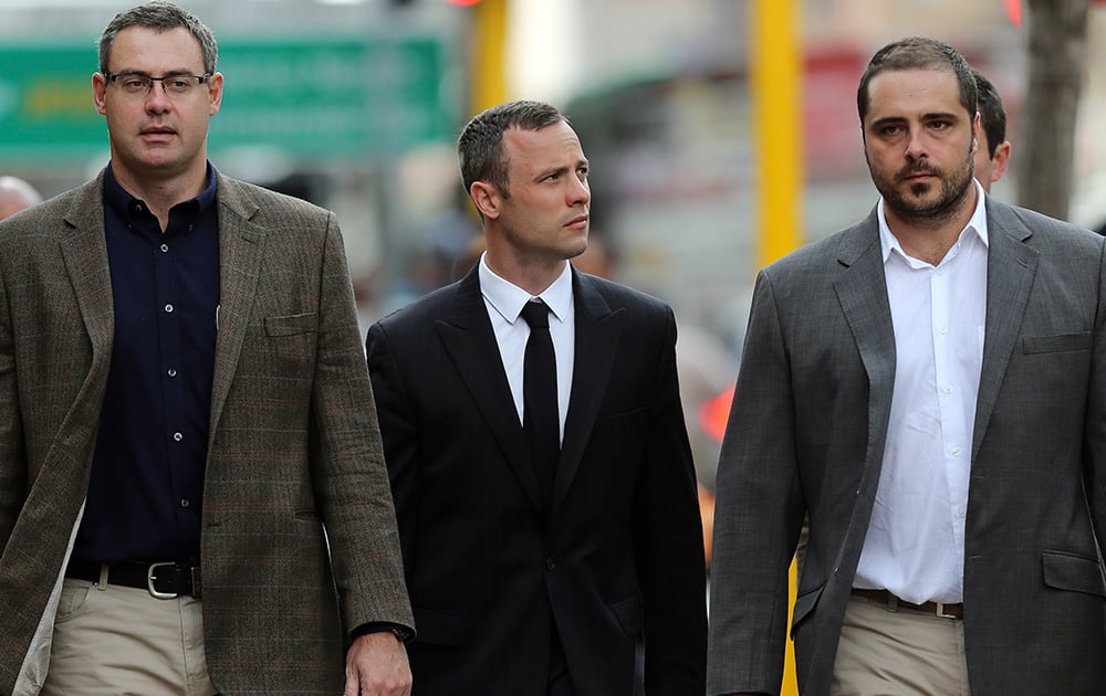 Oscar Pistorius arrives with relatives at the high court in Pretoria, South Africa. Pistorius is charged with murder for the shooting death of his girlfriend Reeva Steenkamp on Valentine`s Day in 2013.