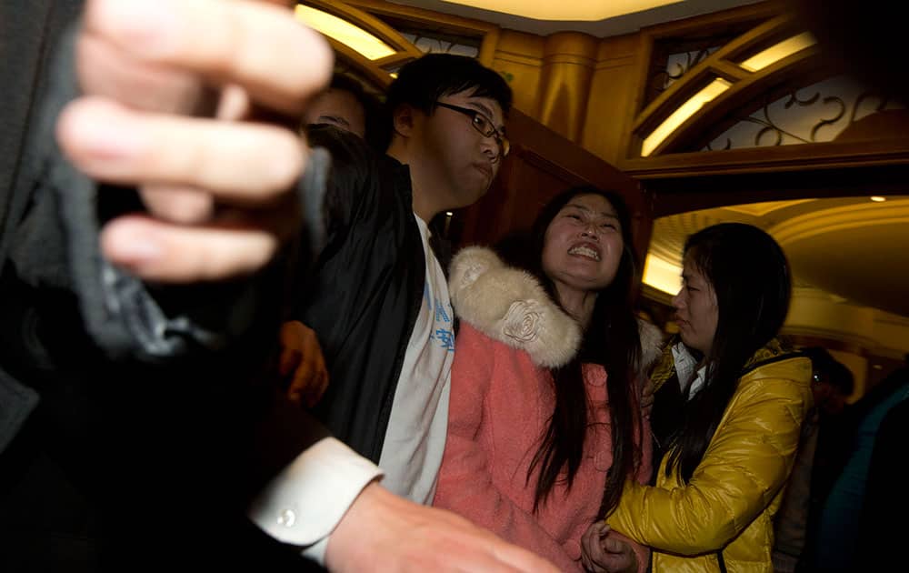 Relatives of Chinese passengers aboard the Malaysia Airlines, MH370 grieve after being told of the latest news in Beijing.
