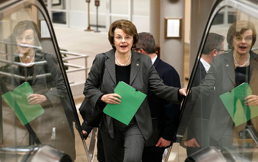 Sen. Dianne Feinstein, D-Calif., chair of the Senate Intelligence Committee, heads to the chamber to advance a bill providing $1 billion in loan guarantees to Ukraine as President Barack Obama meets with US allies in Europe to punish Moscow for its annexation of the Crimean peninsula, at the Capitol in Washington.