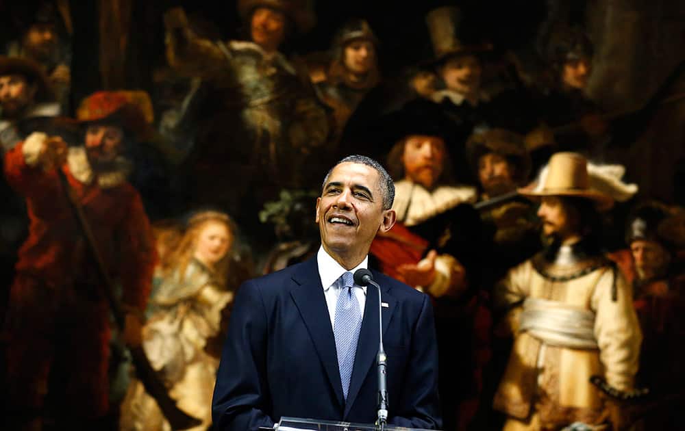 US President Barack Obama delivers a statement in front of Dutch master Rembrandt`s The Night Watch painting during a visit to the Rijksmuseum in Amsterdam, Netherlands.