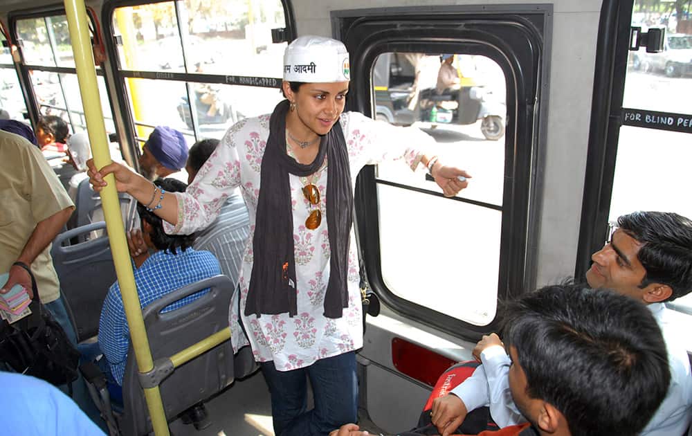 Aam Aadmi Party nominee and former Miss India Gul Panag campaigns on a public bus in Chandigarh.