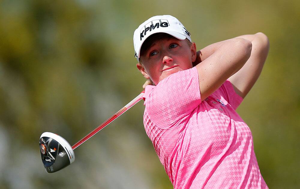 Stacy Lewis hits her tee shot on the 9th hole during the final round of the LPGA Founders Cup golf tournament in Phoenix.