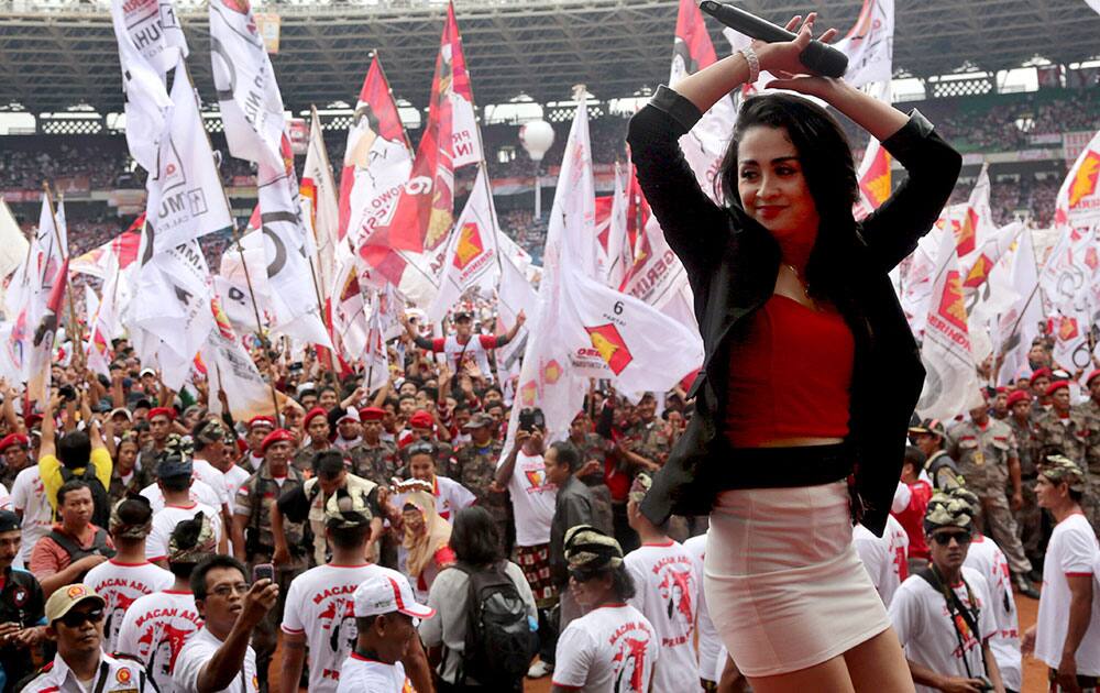 A singer performs on stage during a campaign rally of Indonesian presidential candidate Prabowo Subianto`s Great Indonesia Movement Party at Gelora Bung Karno Stadium in Jakarta.