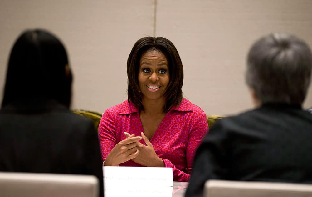US first lady Michelle Obama, center, speaks during a round table discussion on education at the US Embassy in Beijing, China.