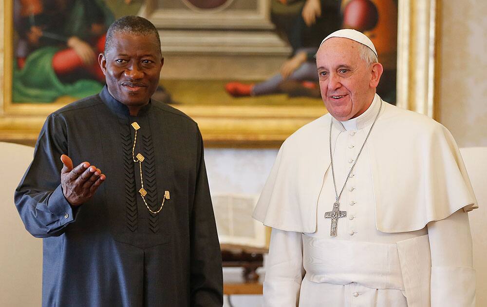Pope Francis and Nigerian President Goodluck Jonathan pose during a private audience at the Vatican.