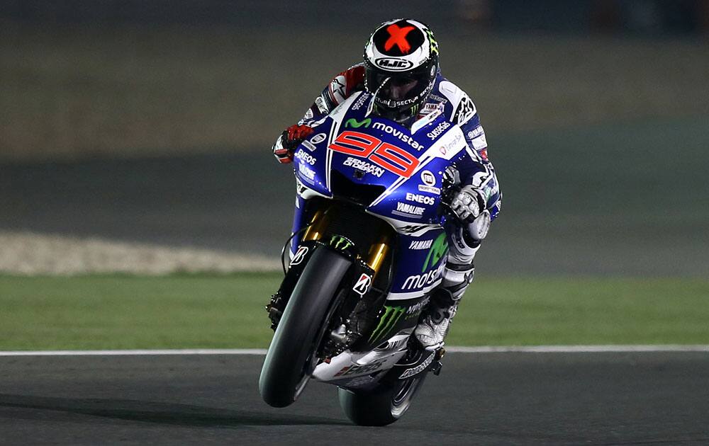 Yamaha MotoGP rider Jorge Lorenzo of Spain steers his bike at the Losail International Circuit during a free practice in Doha, Qatar.