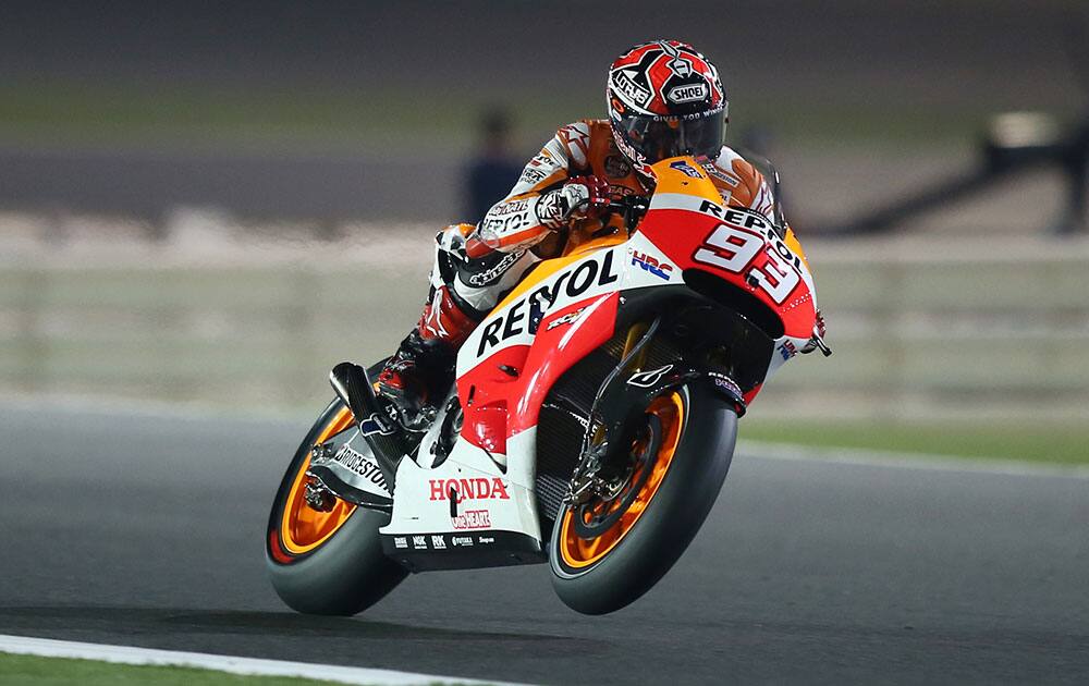 Repsol Honda MotoGP rider Marc Marquez of Spain speeds at the Losail International Circuit during a free practice in Doha, Qatar.