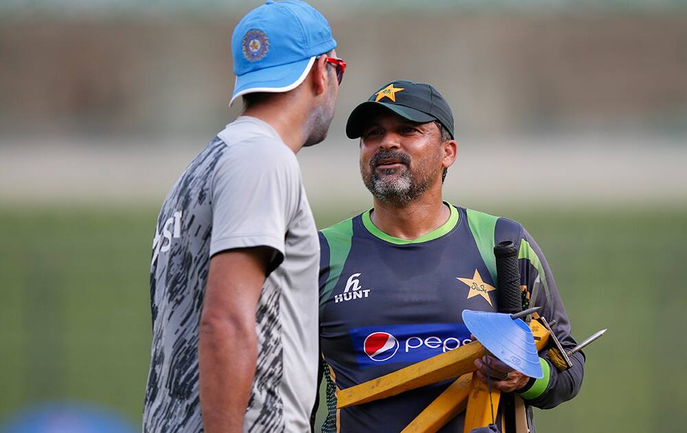 Pakistan cricket team coach Moin Khan talks to Yuvraj Singh during a training session ahead of their ICC Twenty20 Cricket World Cup match in Dhaka, Bangladesh.