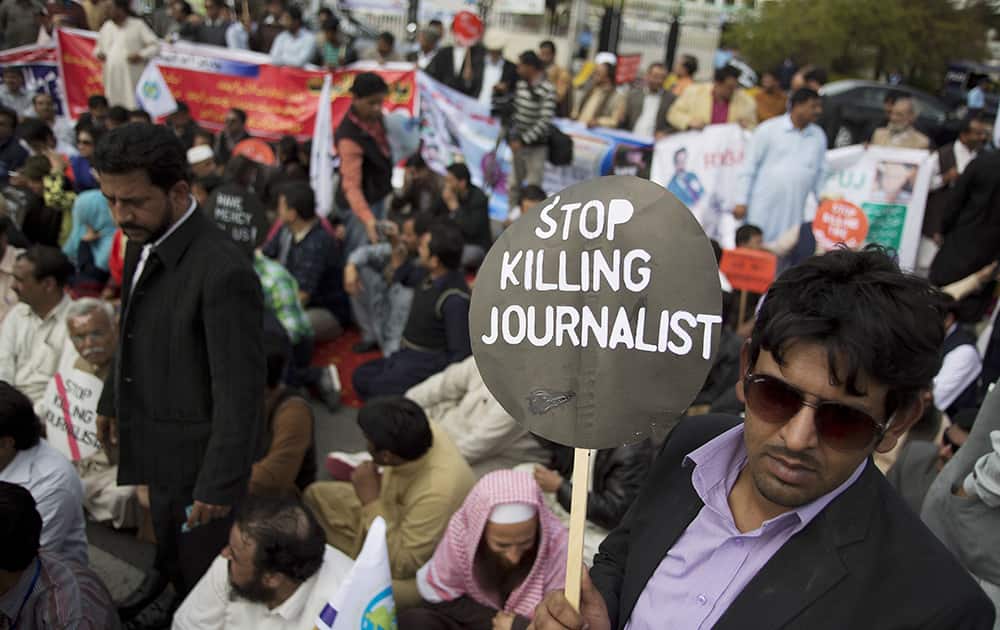 Pakistani journalists hold a sit-in protest before the Parliament demanding protection from the government to work in secured environment in Islamabad.