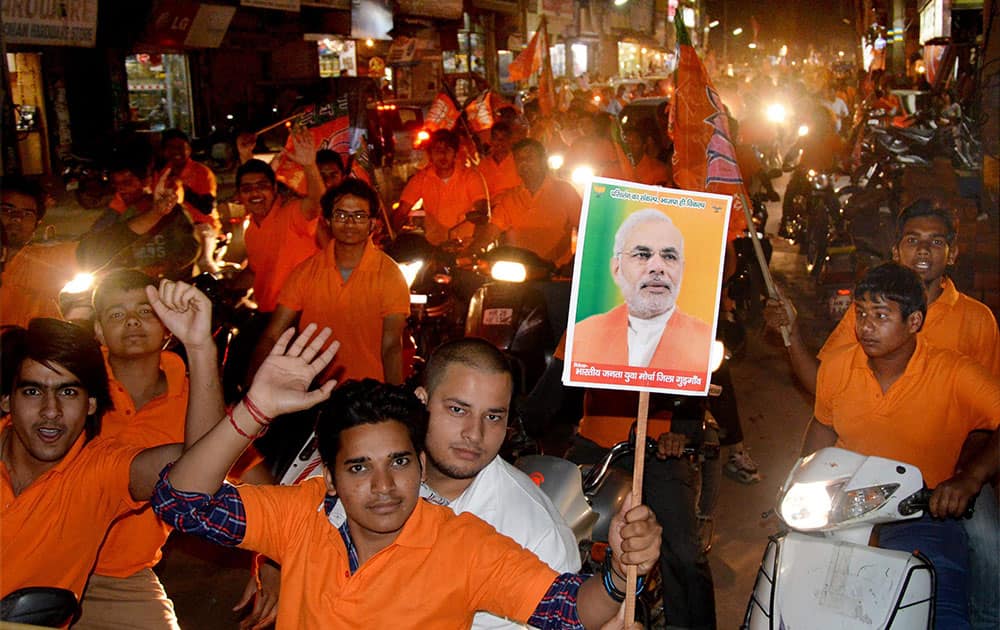 BJP supporters participate in a bike rally to support party`s candidate Rao Inderjit Singh, in Gurgaon.