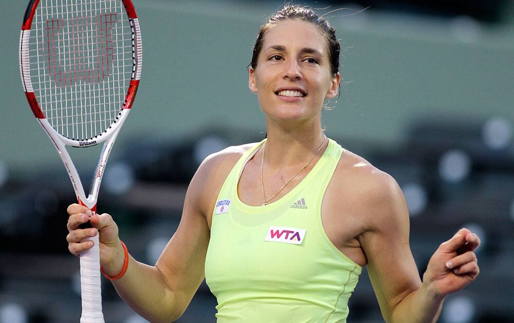 Andrea Petkovic, of Germany, dances for the crowd after defeating Maria-Teresa Torro-Flor, of Spain, 6-3, 6-4 during the Sony Open tennis tournament, in Key Biscayne, Fla.